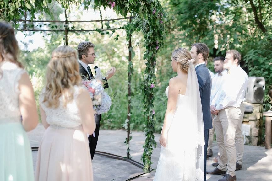 Dr Ian Loughor-Clarke officiating a garden wedding